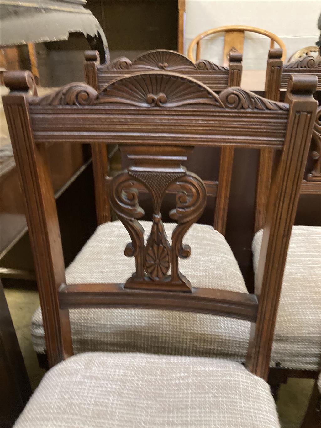 A set of four late Victorian walnut dining chairs